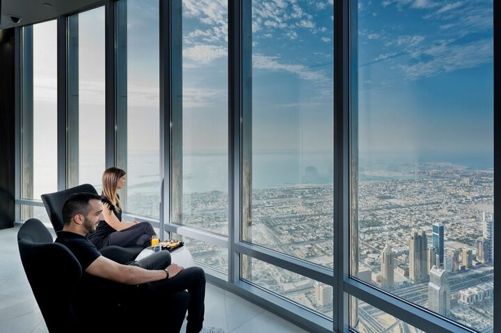 Relax in luxury while enjoying stunning panoramic views of Dubai's skyline from the Burj Khalifa Lounge where exquisite tastes and fascinating stories come together in an unforgettable experience.